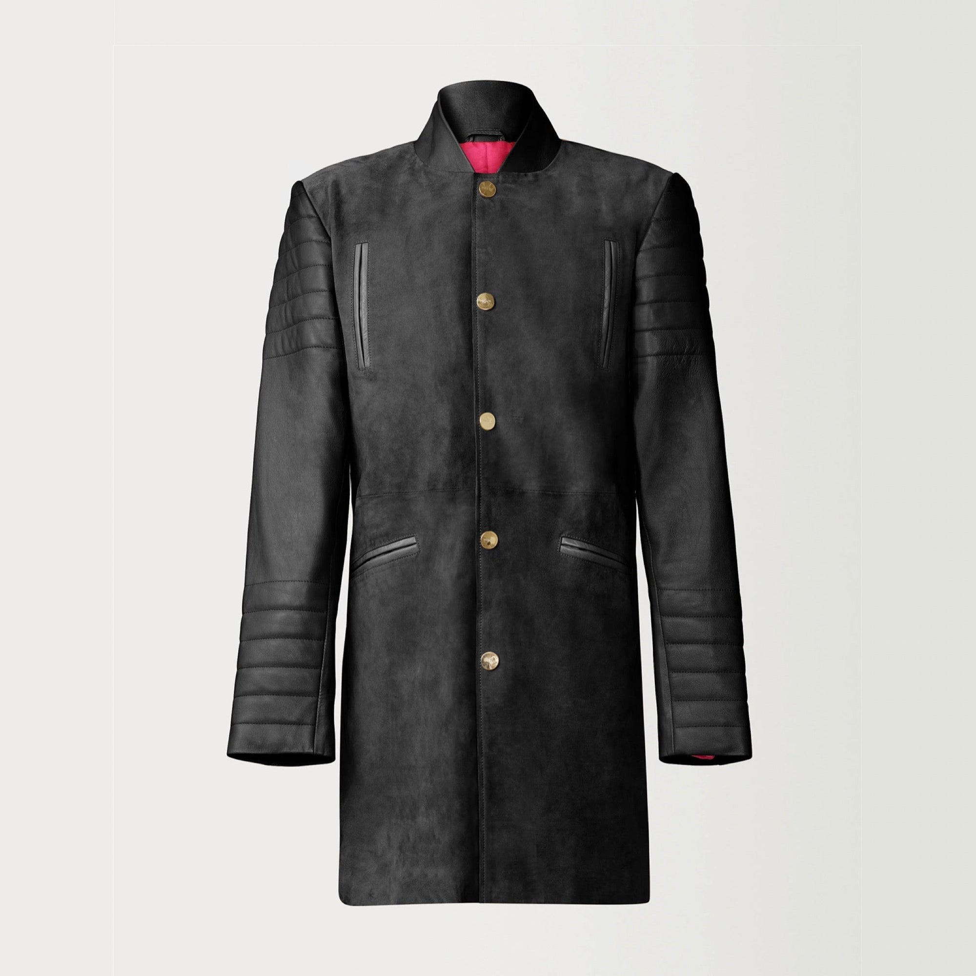 A Beautiful Black Suede Trench Coat, created by designer brand PRSVR. The PRSVR Lab Coat has a suede Body, and lambskin leather sleeves that show off a padded ribbed design on the shoulder and wrist of the sleeve.