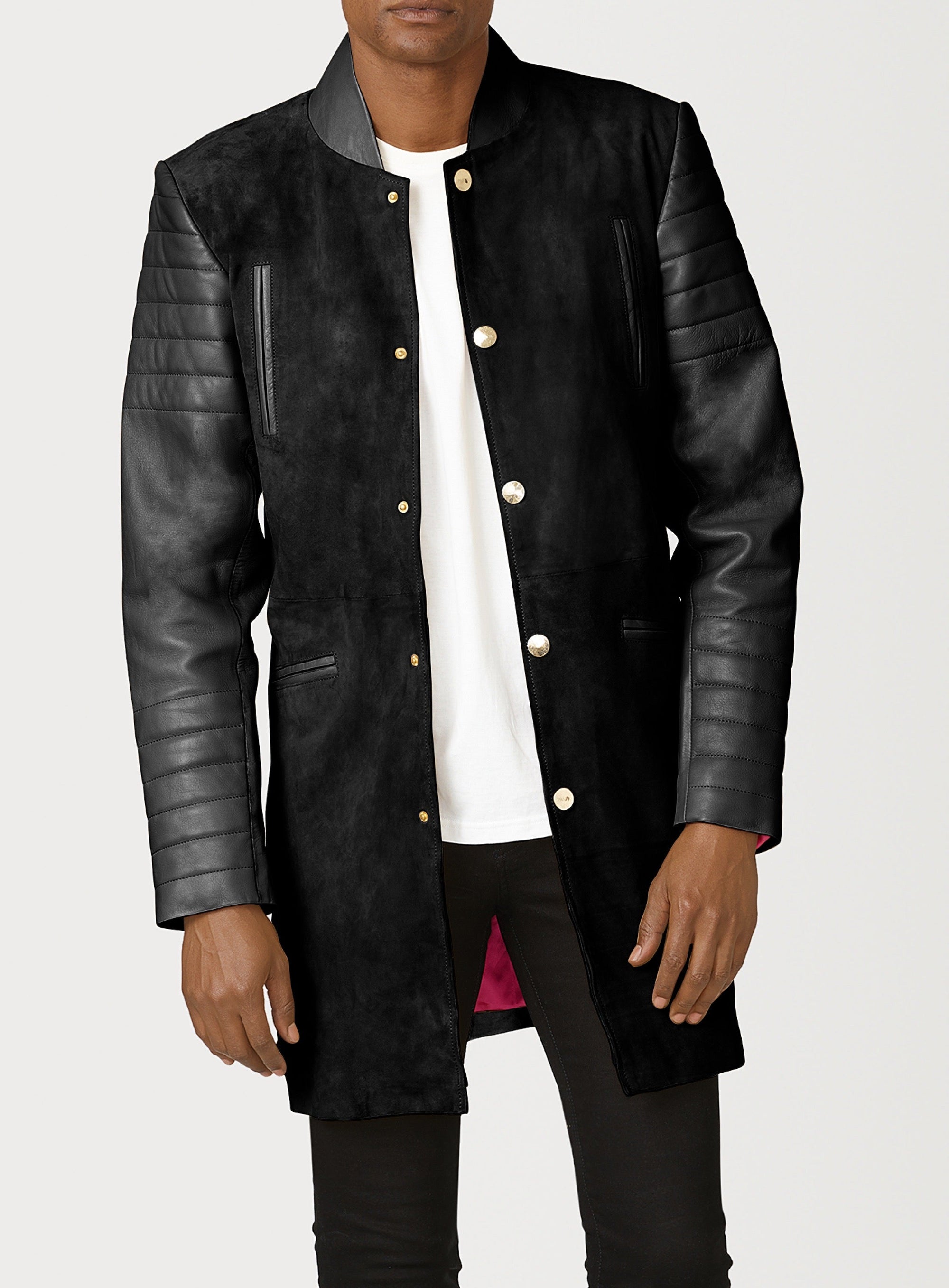 A Beautiful Black Suede Trench Coat, created by designer brand PRSVR. The PRSVR Lab Coat has a suede Body, and lambskin leather sleeves that show off a padded ribbed design on the shoulder and wrist of the sleeve. 